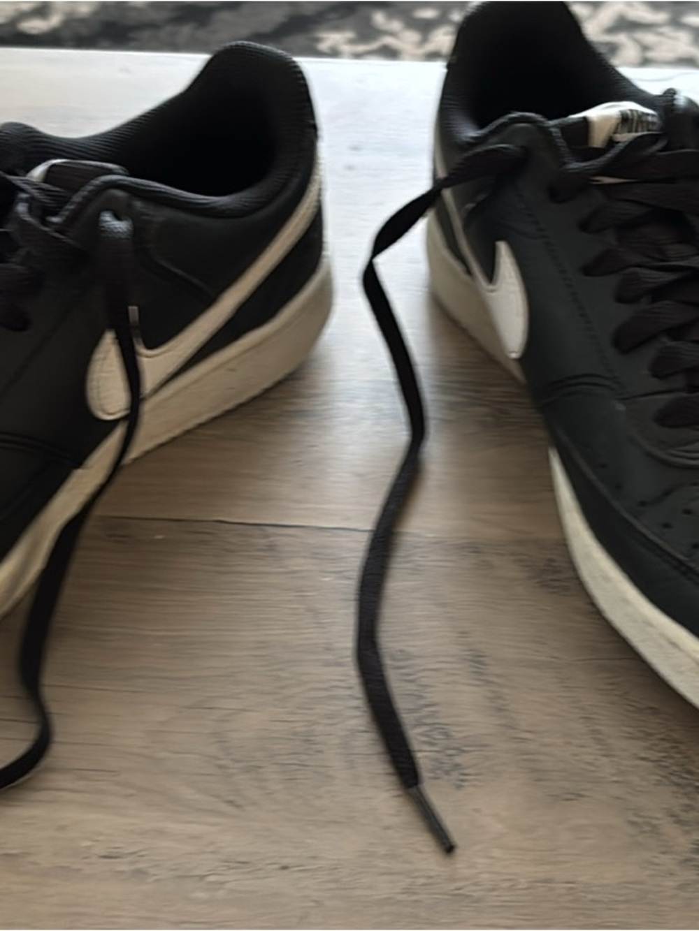 Nike Men’s Black Sneakers with White Swoosh
